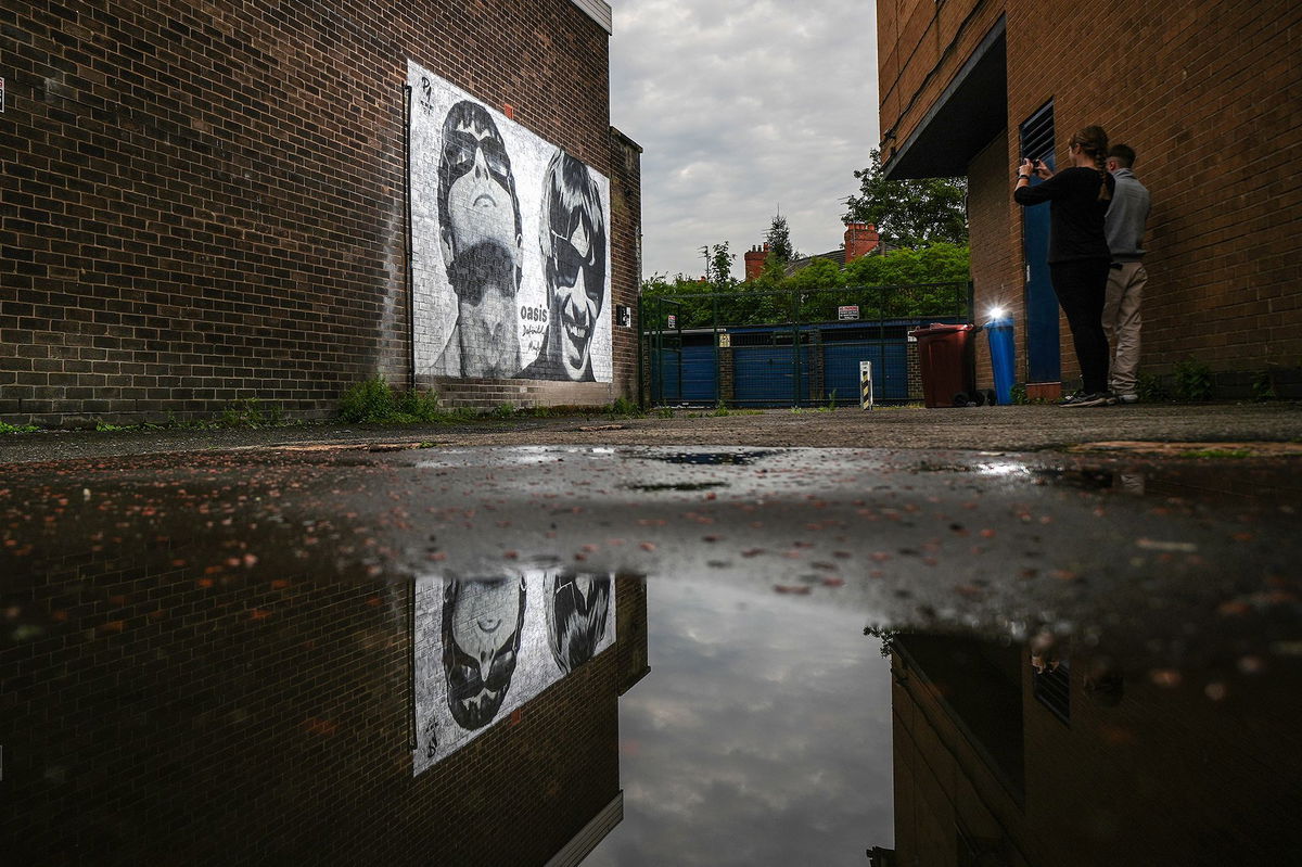 <i>Christopher Furlong/Getty Images via CNN Newsource</i><br/>A mural depicting Liam and Noel Gallagher of Oasis is pictured in Manchester