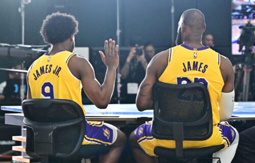 New Los Angeles Lakers guard Bronny James (No. 9) sits next to his dad LeBron James at the Lakers media day at UCLA Health Training Center in El Segundo