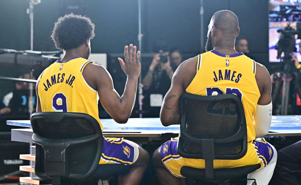 <i>Frederic J. Brown/AFP/Getty Images via CNN Newsource</i><br/>New Los Angeles Lakers guard Bronny James (No. 9) sits next to his dad LeBron James at the Lakers media day at UCLA Health Training Center in El Segundo