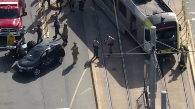 <i>KCAL/KCBS via CNN Newsource</i><br/>A Metro train derailed and crashed into a car in the East Los Angeles neighborhood of Wellington Heights Wednesday morning