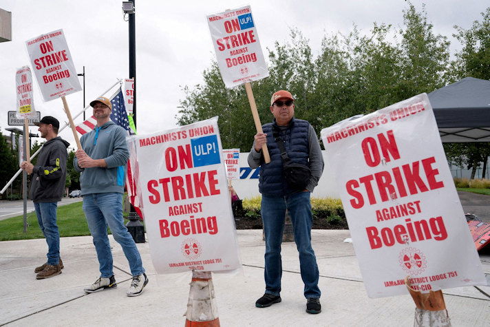 Boeing factory workers and supporters gather on a picket line during the third day of a strike near the entrance to a Boeing production facility in Renton, Washington. Boeing and the International Association of Machinists said talks in the nearly month-old strike have broken off, and no new negotiations are scheduled.