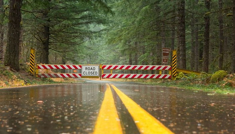 Closed gates on the west side of Oregon Highway 242, the McKenzie Pass Highway.