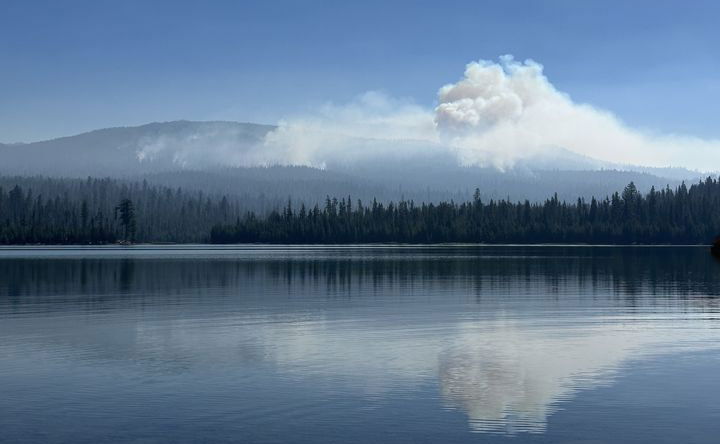 Smoke rises Tuesday from Little Lava Fire as seen from across Little Lava Lake