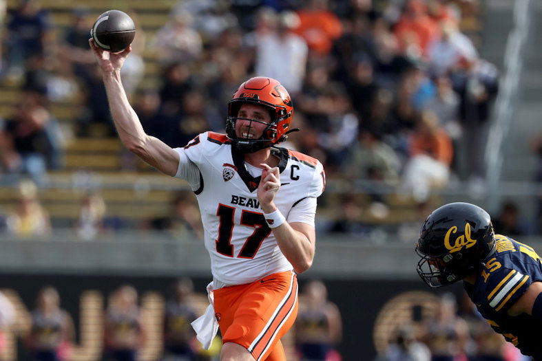 Oregon State quarterback Ben Gulbranson (17) looks to throw as California linebacker Liam Johnson (15) moves in during the second half of an NCAA college football game in Berkeley, Calif., Saturday, Oct. 26, 2024.