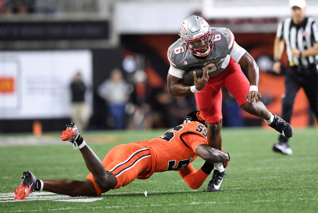 Oregon State linebacker Dexter Foster (55) tackles UNLV quarterback Hajj-Malik Williams (6) during the first half of an NCAA college football game Saturday, Oct. 19, 2024, in Corvallis.