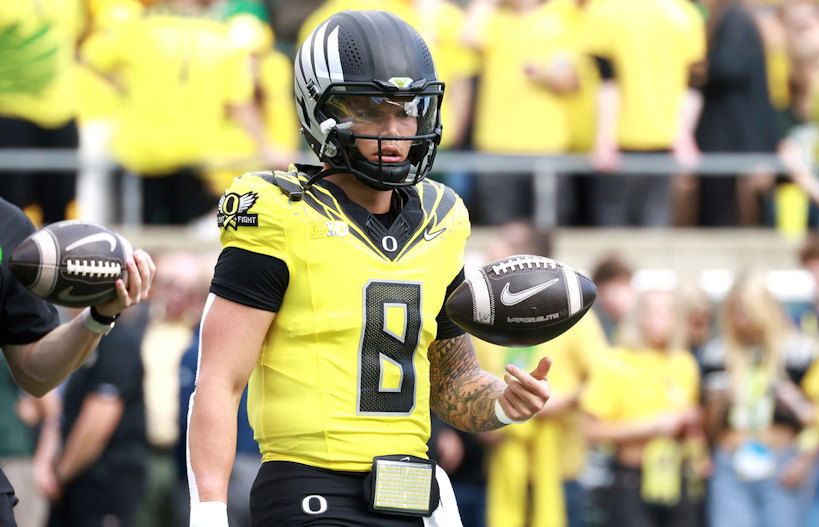 Oregon quarterback Dillon Gabriel warms up before an NCAA college football game against Illinois, Saturday, Oct. 26, 2024, in Eugene.