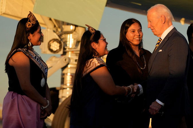 President Joe Biden greets people as he arrives at Phoenix Sky Harbor International Airport, Thursday, Oct. 24, 2024 in Phoenix. 