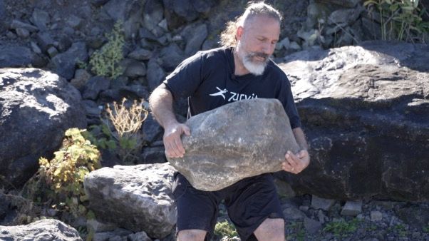 <i>WKBW via CNN Newsource</i><br/>This stone in Johnson's hands weighs roughly 200 pounds.