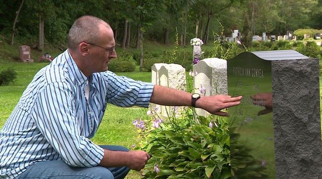 <i>WCVB via CNN Newsource</i><br/>Frank Gonyea visits the grave of his sister Patricia.