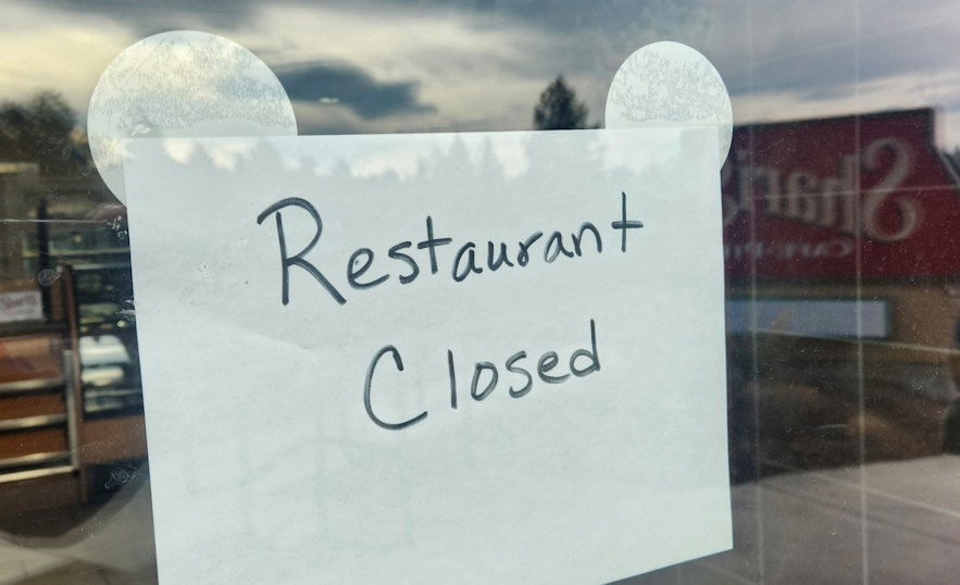 Sign taped to the door Sunday afternoon at the north Bend Shari's Restaurant.