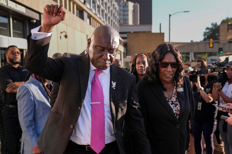 Attorney Ben Crump, left, RowVaughn Wells, right, leave the federal courthouse after three former Memphis police officers were convicted of witness tampering charges in the 2023 fatal beating of Tyre Nichols, Thursday, Oct. 3, 2024, in Memphis, Tenn.