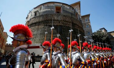 Members of the Vatican's elite Swiss Guard march in front of the Institute for the Works of Religion (IOR).