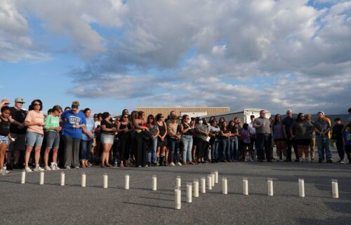 Candles are set out in the shape of a cross where almost 200 people gathered for a candlelight vigil on Thursday for the Erwin