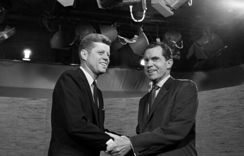 Presidential candidates John F. Kennedy and Richard Nixon shake hands after their televised debate in Washington