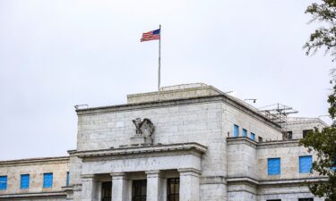 The US flag flies over the Federal Reserve on October 3 in Washington