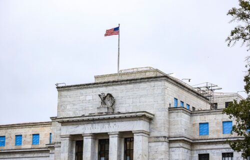 The US flag flies over the Federal Reserve on October 3 in Washington