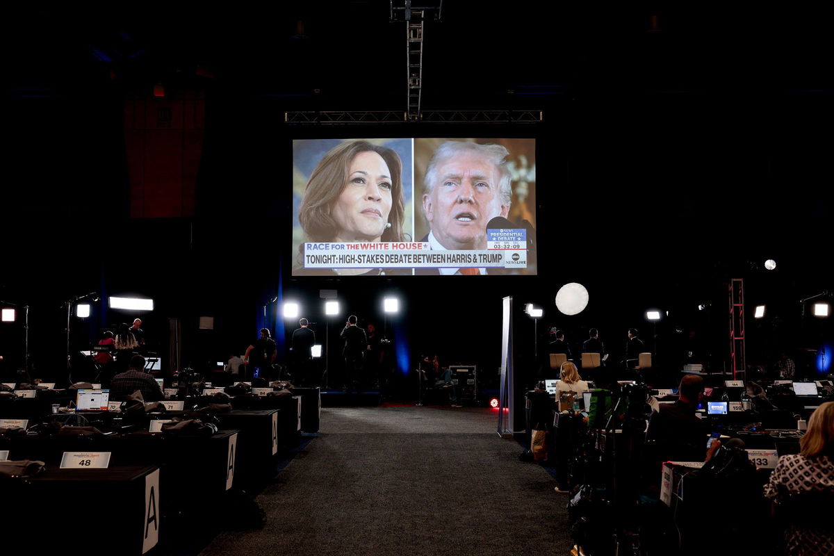 <i>Hannah Beier/Bloomberg/Getty Images via CNN Newsource</i><br/>Vice President Kamala Harris and former President Donald Trump are seen on a TV screen at the Pennsylvania Convention Center in Philadelphia on September 10