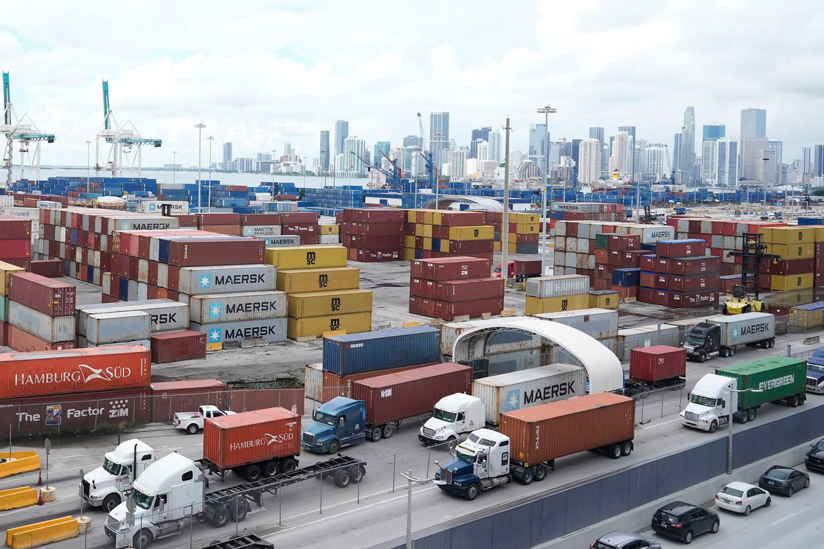 <i>Marta Lavandier/AP via CNN Newsource</i><br/>Trucks line up to enter Port Miami