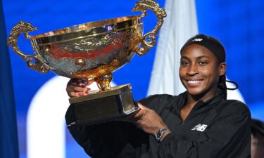 Coco Gauff celebrates with the trophy after winning the women's singles final match against Czech Republic's Karolina Muchova at the China Open.