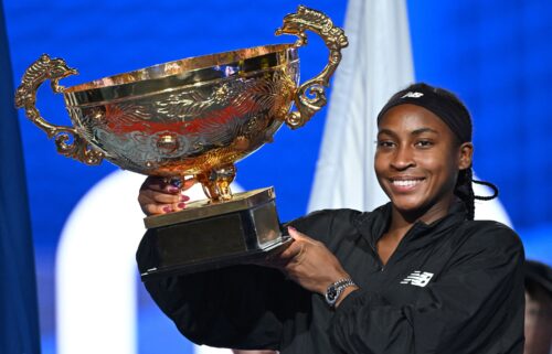 Coco Gauff celebrates with the trophy after winning the women's singles final match against Czech Republic's Karolina Muchova at the China Open.