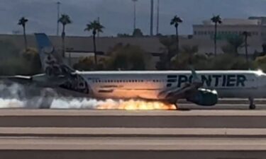 Video captured the moment when fire was seen underneath a Frontier flight as it landed at Harry Reid International Airport in Las Vegas.