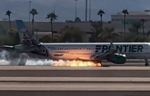 Video captured the moment when fire was seen underneath a Frontier flight as it landed at Harry Reid International Airport in Las Vegas.