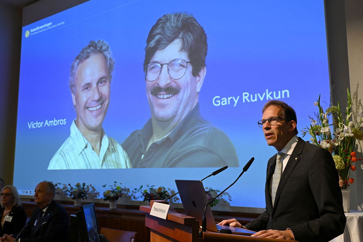 <i>Jonathan Nackstrand/AFP/Getty Images via CNN Newsource</i><br/>Nobel Committee Secretary General Thomas Perlmann speaks to the media in front of a picture of this year's laureates Victor Ambros and Gary Ruvkum during the announcement of the Nobel Prize in medicine winners on Monday.