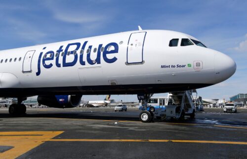 A JetBlue airplane sits on the tarmac at John F. Kennedy International Airport in New York in 2017. JetBlue’s economy class passengers will no longer find hot meals on the menu aboard transatlantic flights.