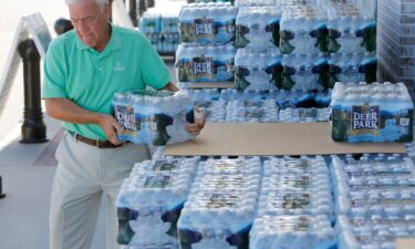 Larry Pierson purchases bottled water from the Harris Teeter grocery store on the Isle of Palms in preparation for Hurricane Florence in September 2018.