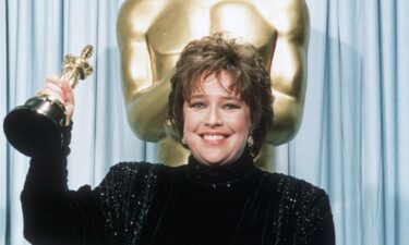 Kathy Bates holds her Oscar statuette backstage at the 63rd annual Academy Awards in 1991. Bates won best actress for her performance in "Misery."