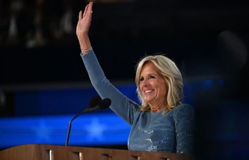 First lady Jill Biden waves from the stage on the opening night of the DNC on Monday