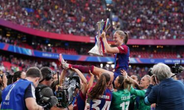 Graham Hansen celebrates with the 2023/24 UEFA Women's Champions League Trophy.