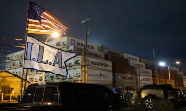 The ILA flag and an American flag fly together outside the Packer Avenue Marine Terminal Port in Philadelphia