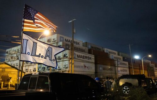 The ILA flag and an American flag fly together outside the Packer Avenue Marine Terminal Port in Philadelphia