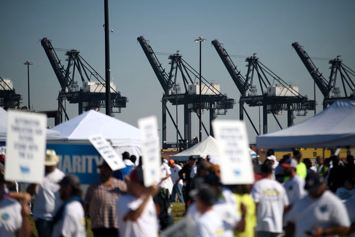 <i>Mark Felix/AFP/Getty Images via CNN Newsource</i><br/>Dockworkers strike at the Bayport Container Terminal in Seabrook