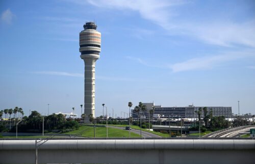 The FAA air traffic control tower is pictured at Orlando International Airport. The Federal Aviation Administration says that graduates of two college air traffic control programs can now bypass the agency’s backlogged training academy.