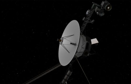 A rendering depicts the Voyager 2 spacecraft