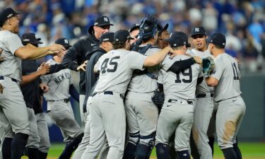 The New York Yankees celebrate the win over the Kansas City Royals in game four of the ALDS at Kauffman Stadium.