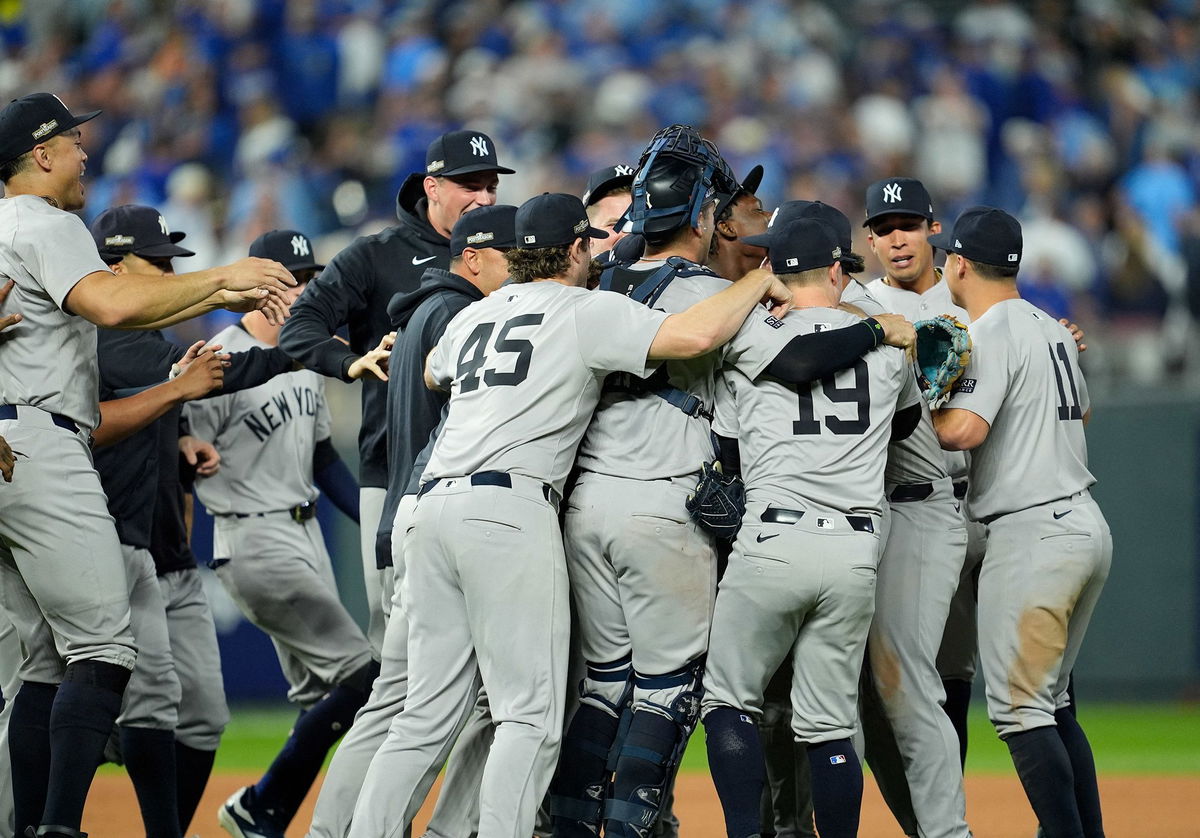 <i>Jay Biggerstaff/USA Today Sports/Reuters via CNN Newsource</i><br/>The New York Yankees celebrate the win over the Kansas City Royals in game four of the ALDS at Kauffman Stadium.