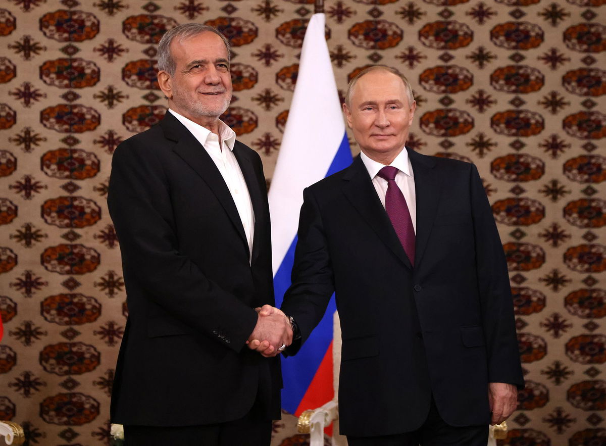 <i>Getty Images via CNN Newsource</i><br/>Putin and Pezeshkian shake hands during their first meeting