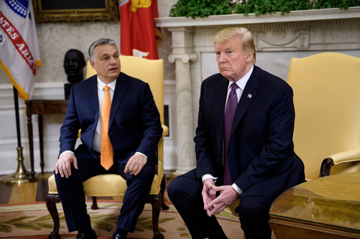 <i>Brendan Smialowski/AFP/Getty Images via CNN Newsource</i><br/>Hungary's Prime Minister Viktor Orban and US President Donald Trump wait for a meeting in the Oval Office of the White House May 13