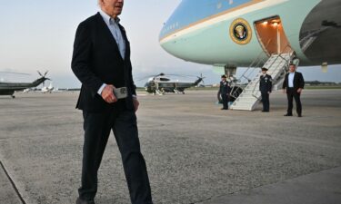 President Joe Biden walks to speak to reporters at Joint Base Andrews in Maryland on October 3. During a visit to survey Hurricane Milton's damage