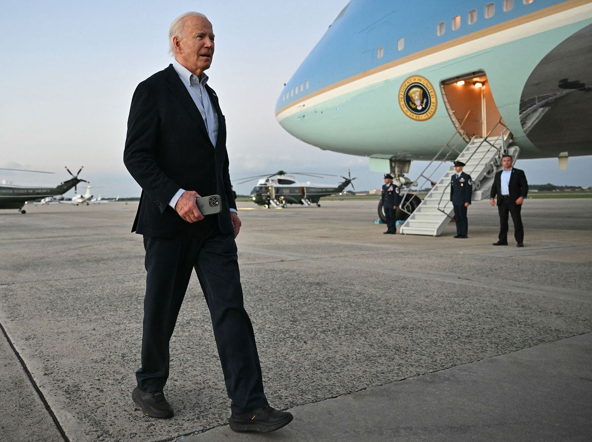 <i>Mandel Ngan/AFP/Getty Images via CNN Newsource</i><br/>President Joe Biden walks to speak to reporters at Joint Base Andrews in Maryland on October 3. During a visit to survey Hurricane Milton's damage