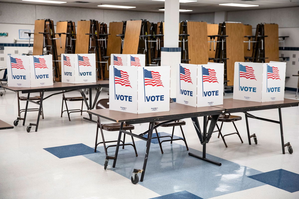 <i>Samuel Corum/Getty Images via CNN Newsource</i><br/>Voting booths sit empty at a polling location in Arlington