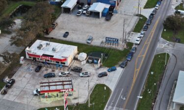 An aerial view shows vehicles lined up to wait for gas at a Circle K station on October 11