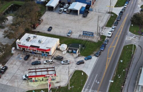 An aerial view shows vehicles lined up to wait for gas at a Circle K station on October 11