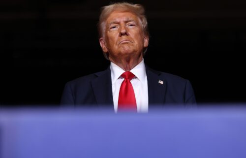 Former President Donald Trump greets supporters during a campaign rally at the Grand Sierra Resort on October 11 in Reno