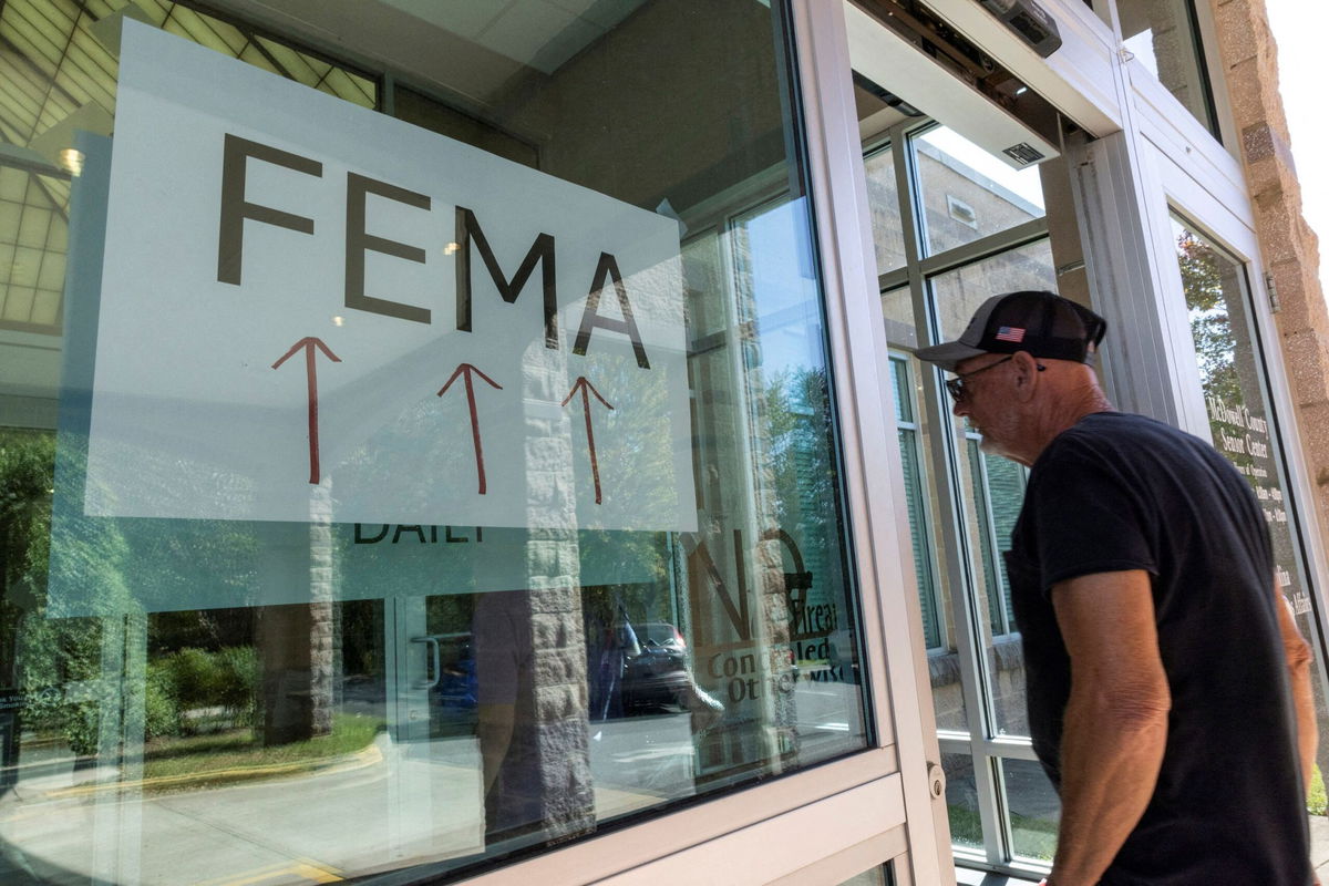 <i>Eduardo Munoz/Reuters via CNN Newsource</i><br/>A resident enters a FEMA improvised station to attend claims by local residents affected by floods following the passing of Hurricane Helene