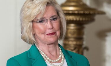 Women’s rights activist Lilly Ledbetter looks to the audience as President Barack Obama speaks in the East Room of the White House