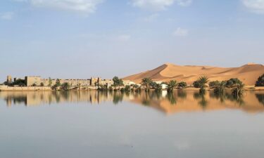 Buildings along a lake filled by heavy rainfall are pictured in the desert town of Merzouga on October 2.